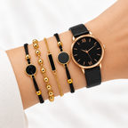 Black dial rose gold watch and bracelet set worn on wrist