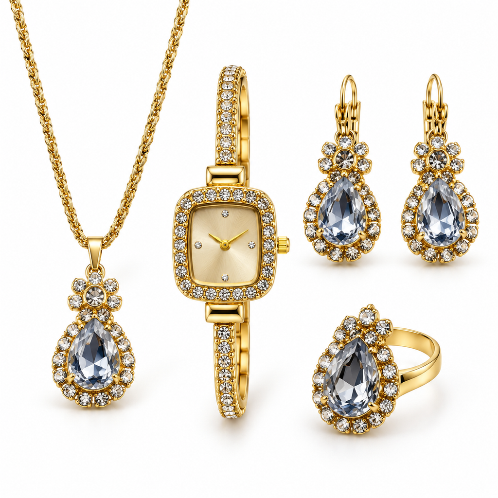 Gold crystal watch with teardrop necklace ring and earrings on white studio background