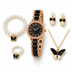 Rose gold black butterfly watch and pearl jewellery set on white background